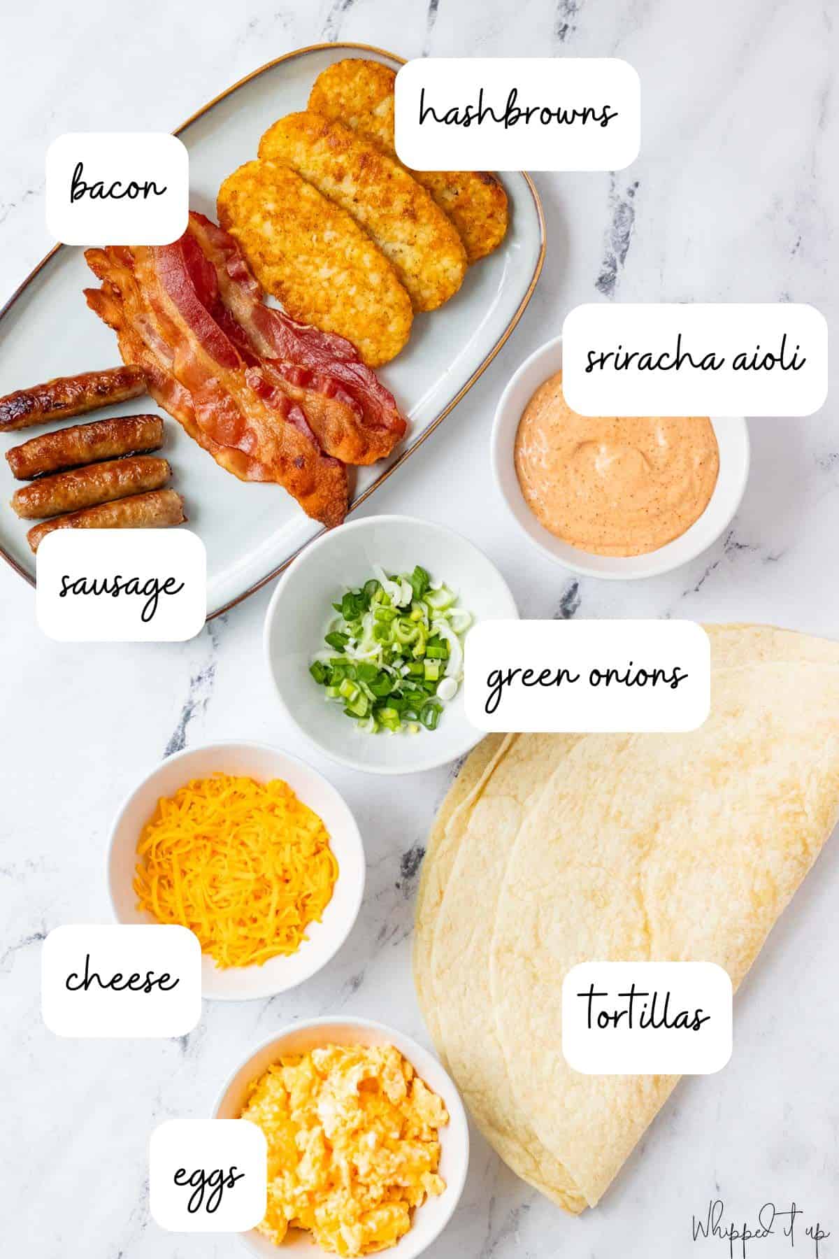 Ingredients to make breakfast burritos are laid out on a marble countertop.