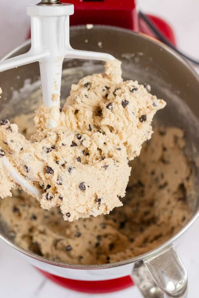 Finished cookie dough on the paddle of a stand mixer.