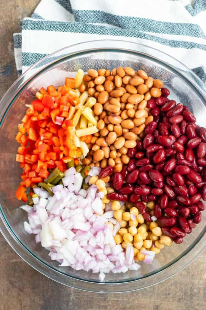 All of the ingredients in a clear glass mixing bowl.